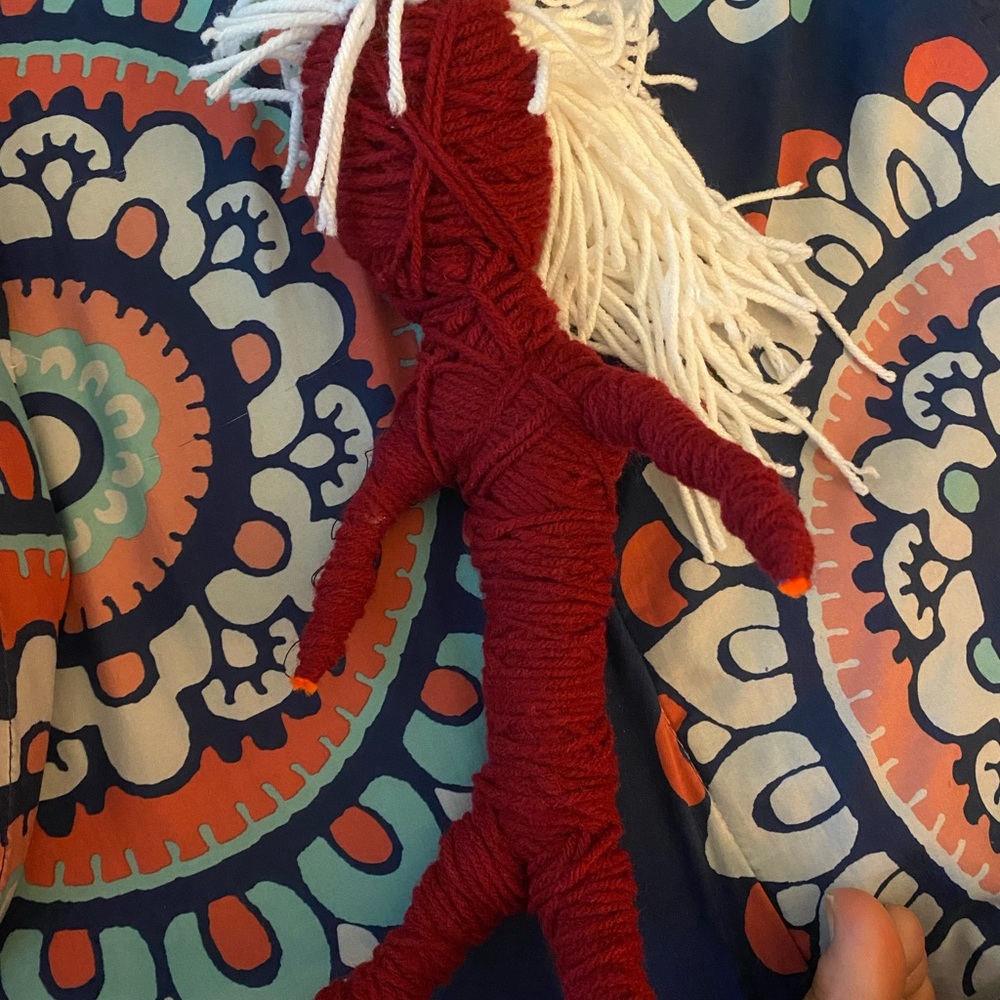 Red yarn doll